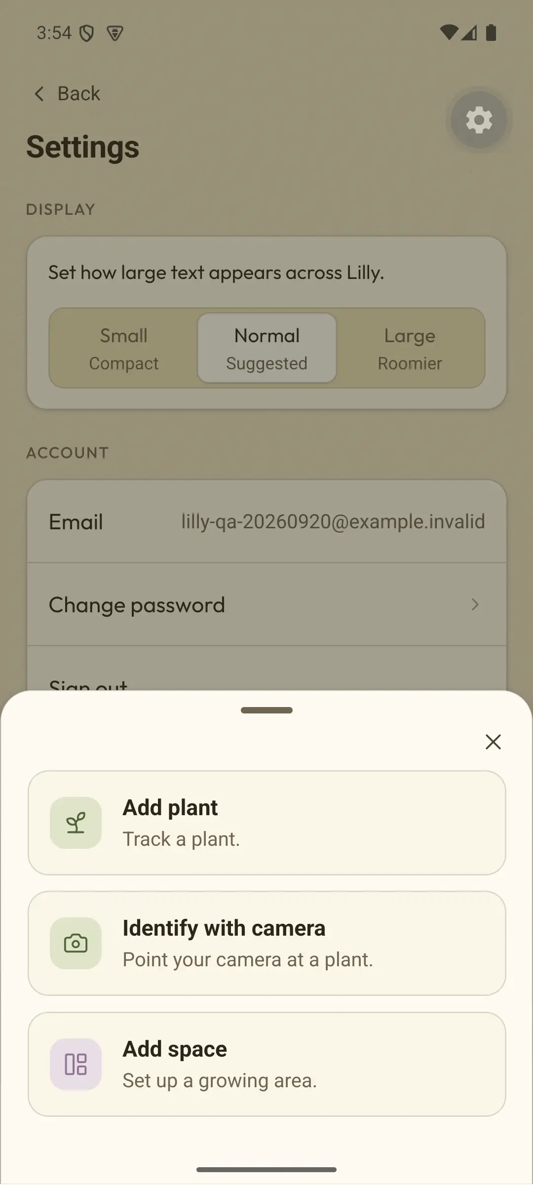 Real beta screen, from when the app was called Lilly. Add menu with three choices: Add plant, Track a plant. Identify with camera, Point your camera at a plant. Add space, Set up a growing area.